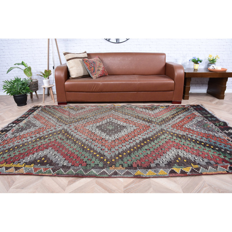 Tapis turc fabriqué à la main dans des tons de terre, idéal pour décorer un salon ou une chambre à coucher