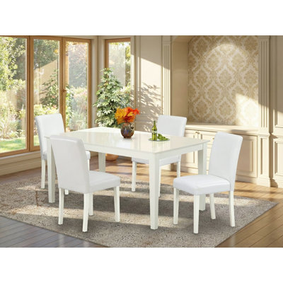 L'ensemble de mobilier de salle à manger 5 pièces comprend une table de salle à manger rectangulaire et 4 chaises Parson revêtues de similicuir blanc, 36 x 60 pouces, lin blanc