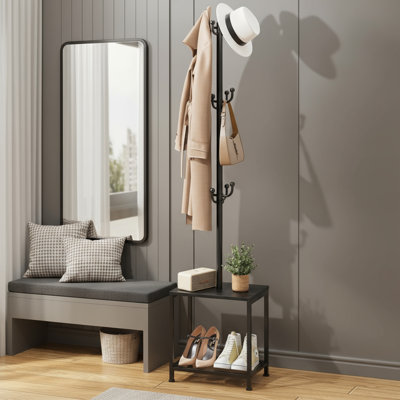 Portemanteau noir autoportant avec banc, étagère à chaussures et tabouret, en forme d'arbre avec tablette, idéal pour suspendre des chapeaux et des sacs dans le vestibule.