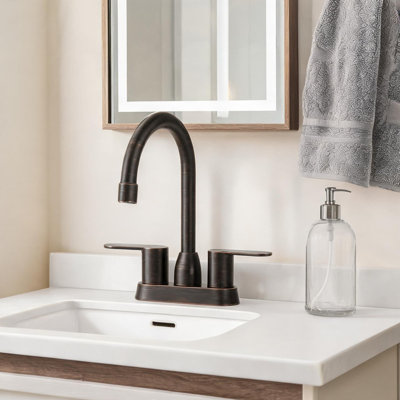 Robinet pour salle de bain 4 po en bronze huilé avec bec pivotant, bonde escamotable et deux poignées