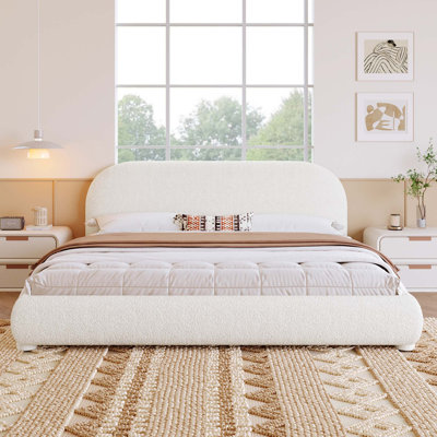 Lit tapissier moderne avec tête de lit courbée et tissu granulaire