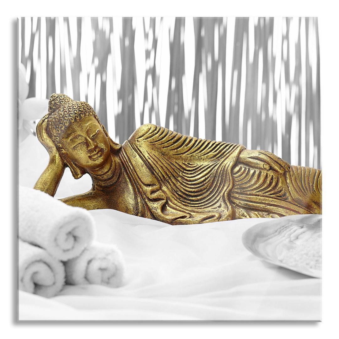 Glasbild "Goldener Buddha auf Handtuch"