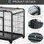 Cage pour chien pliable en métal gris foncé avec plateau amovible, couvercle et 4 roulettes verrouillables pour un assemblage facile