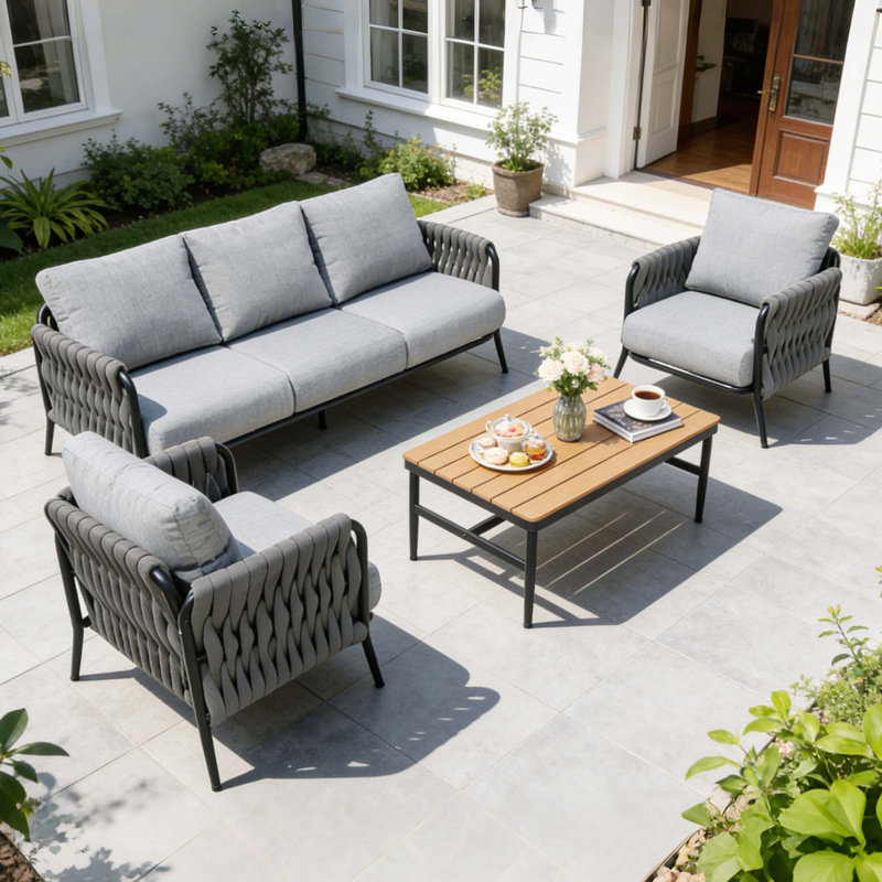 Ensemble de conversation 4 pièces en corde de patio tissé à la main, coussins en oléfine et table basse WPC, capacité de 330 lb pour les loisirs en plein air
