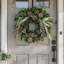 26" Holiday Evergreen Wreath With Snowy Branches And Pinecones