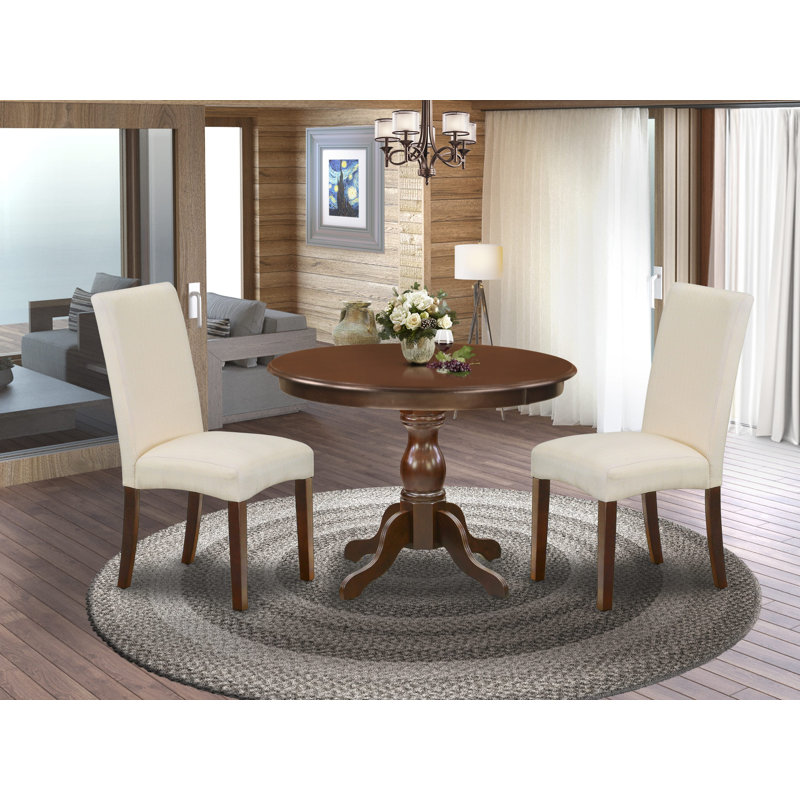 L'ensemble de mobilier de salle à manger 3 pièces comprend une table de salle à manger ronde avec piédestal et 2 chaises Parson rembourrées en lin crème, acajou