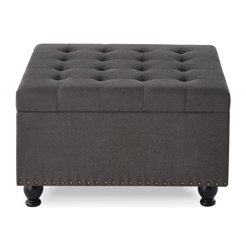 Grand repose-pieds carré avec rangement et pieds en bois, table basse capitonnée avec garniture cloutée pour espace de vie, gris foncé