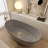 64.96" Freestanding Soaking Solid Surface Bathtub-111987439