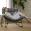 Chaise berçante d'extérieur en métal avec coussins