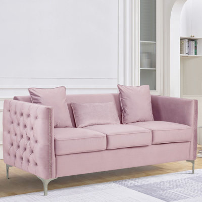 Canapé en velours mauve avec 3 coussins