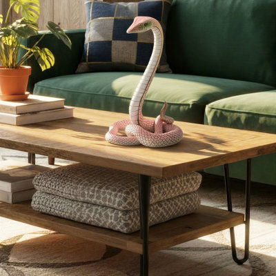 Figurine de serpent en résine rose