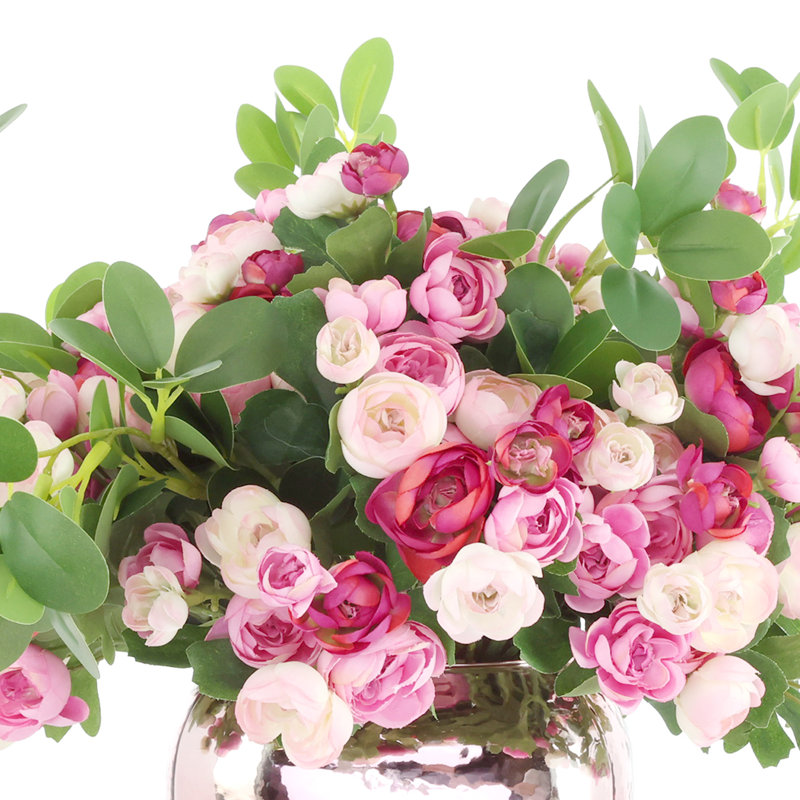 Arrangement de renoncule dans un vase en verre mercurisé