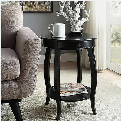 Une table d'appoint noire avec un tiroir