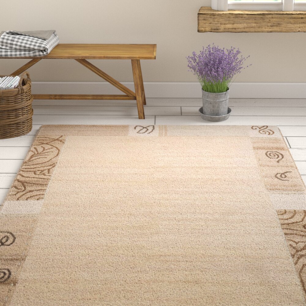 Handgefertigter Teppich Brocadero aus Wolle in Beige