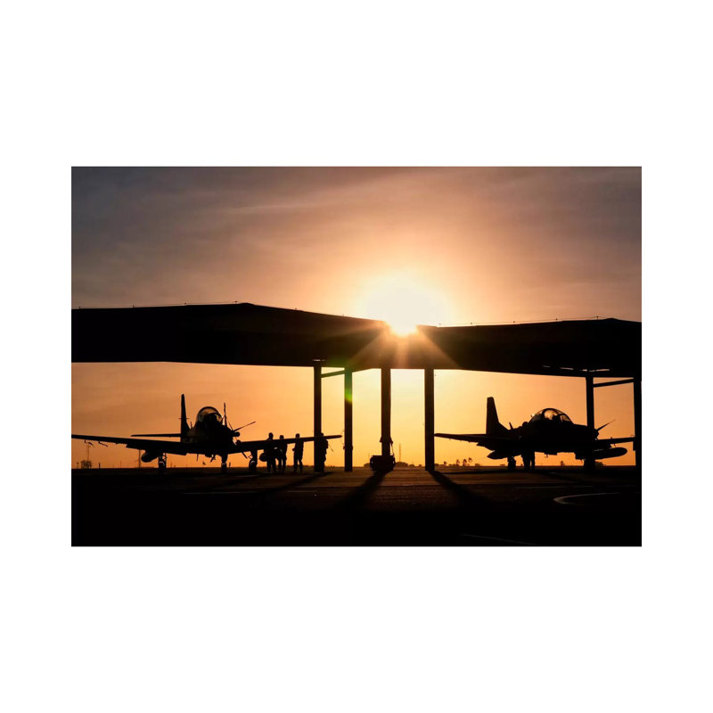 Two Embraer A-29 Super Tucano Aircraft Parked In The Hangar by Giovanni Colla - Wrapped Canvas Print