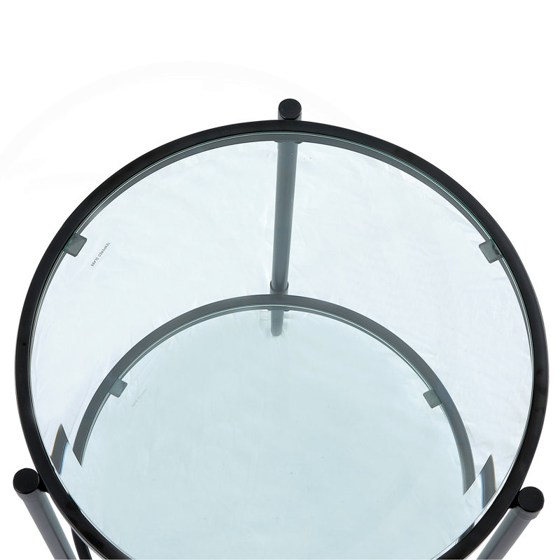 Table basse élégante et minimaliste, verre trempé transparent et cadre industriel noir mat