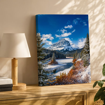 Canvas A Breathtaking Winter Landscape Featuring A Majestic Snow Capped Mountain Wall Art Rising Prominently Against A Brilliant Blue Canvas Wall Art