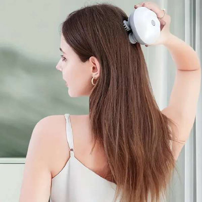 Portable and handheld scalp massager
