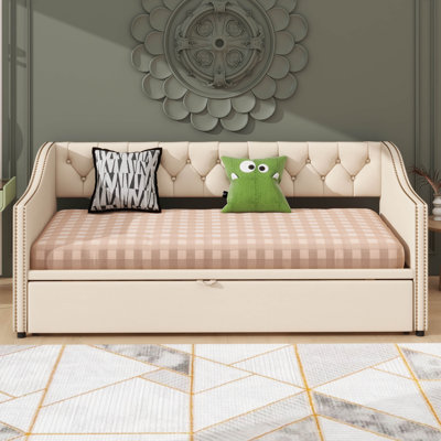 Twin-Sized Upholstered Daybed With A Pop-Up Trundle Feature