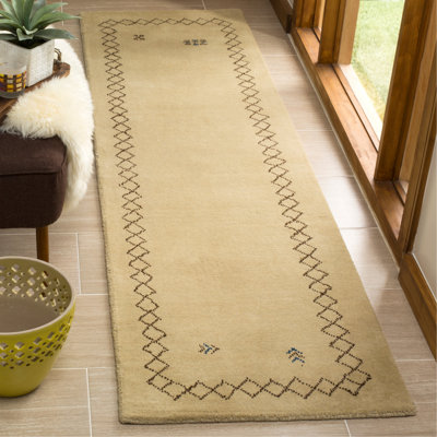 Tapis beige en laine tissé à la main à motif géométrique Coraima