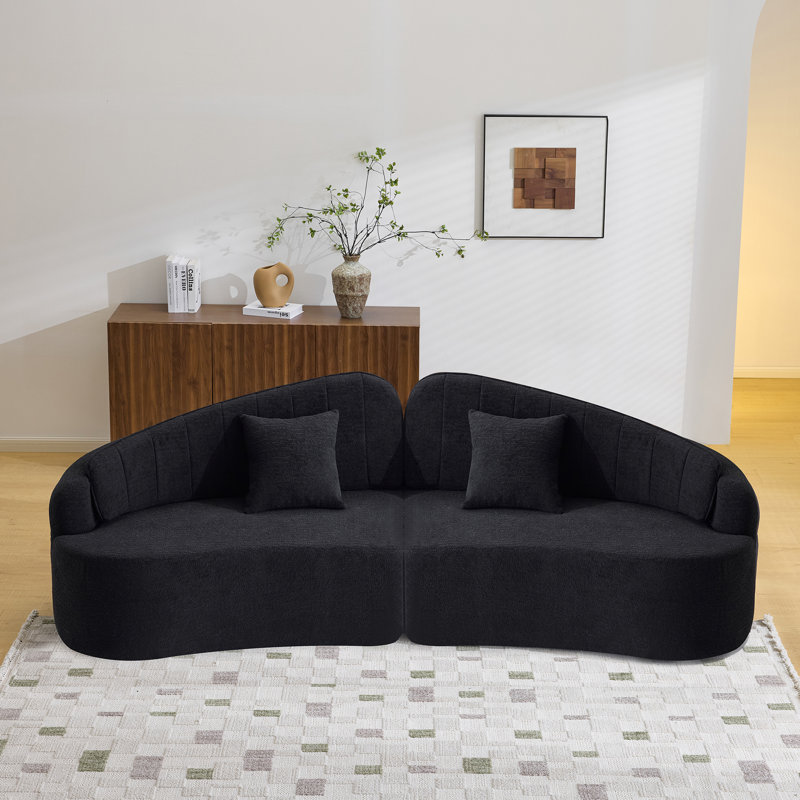 Canapé noir peu encombrant, mousse et ressorts, design rétro pour petits appartements