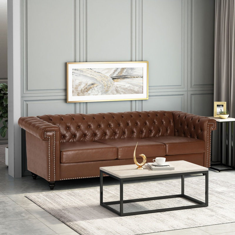 Sione 83" Upholstered Chesterfield Sofa Bring home a timeless addition to your living room with our lasting Chesterfield-style sofa