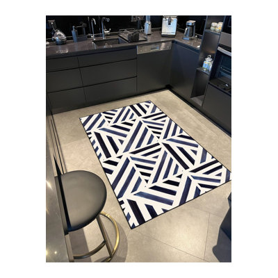 Tapis noir lavable à motifs géométriques