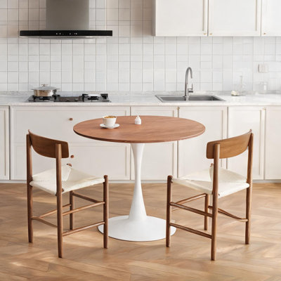 Table de salle à manger ronde blanche sur pied central, 4 couverts, facile à installer, idéale pour la cuisine et la salle à manger.