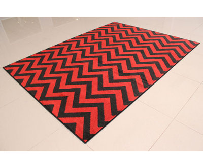 Tapis orange tissé à la machine