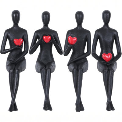 Ensemble de 4 statues minimalistes en résine représentant des personnages assis tenant des cœurs