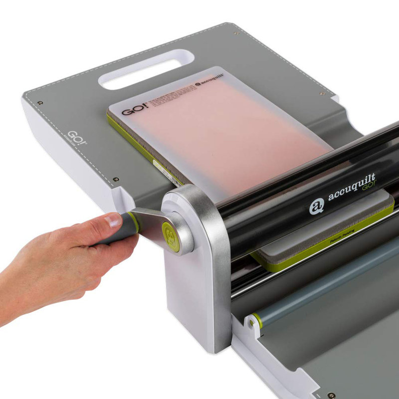 AccuQuilt GO! Fabric Cutter Starter Set including the GO! Fabric Cutter, Original Handle, GO! Value Fabric Cutting Die, GO! 6” x 12” Cutting Mat, 20 Pg Pattern Book, and Die Pick.