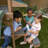 Wilderness Point Wooden Swing Set with Table, Bench and Art Panel