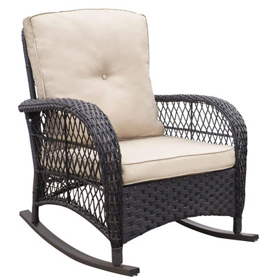 Chaise berçante d'extérieur en rotin avec coussins
