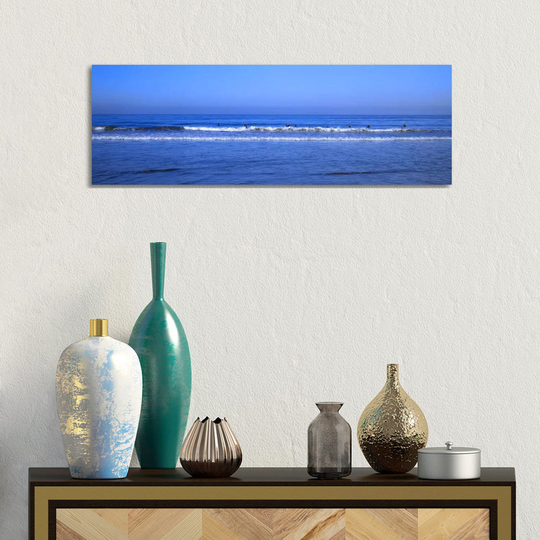 Surfers Riding A Wave In The Sea - Wrapped Canvas Panoramic Print