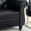 Fauteuil une place au charme intemporel, revêtement en PU souple, pieds en bouleau, hauteur d'assise de 32 cm, largeur des accoudoirs de 22 cm, ambiance harmonieuse, revêtement en PU noir imitation cuir, assise en bois de 57 cm, hauteur de dossier de 49 cm.