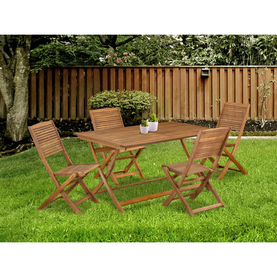 L'ensemble de table de jardin pour patio comprend une table rectangulaire en acacia et des chaises pliantes