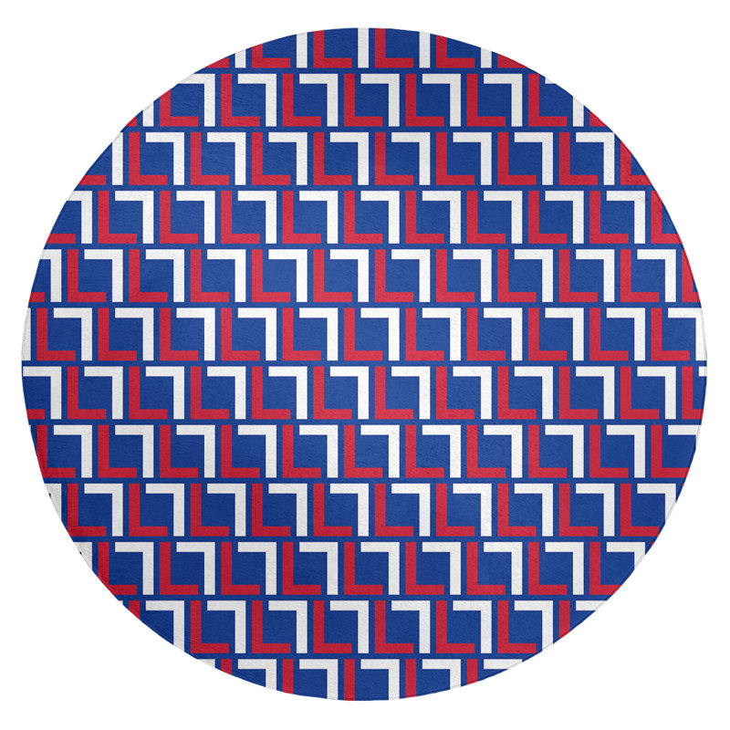 Tapis rond rouge / bleu à motif géométrique