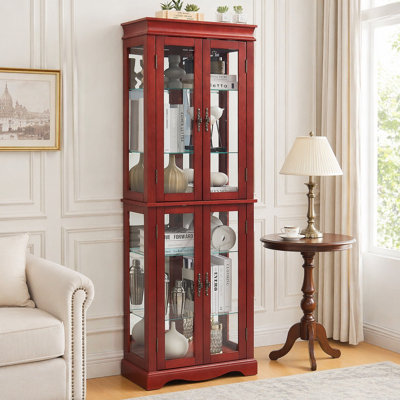 Vitrine lumineuse en verre avec tablettes réglables et éclairage interne, parfaite pour mettre en valeur des objets de collection dans les salons et les cuisines.