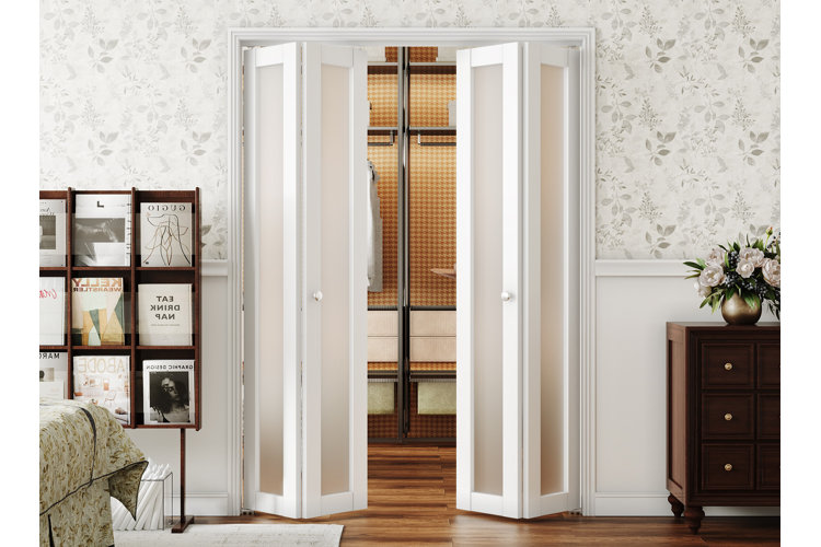A bedroom with double frosted glass bifold doors slightly open to reveal a closet.