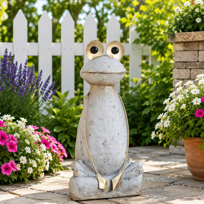 Figurine abstraite de grenouille en magnésium blanc avec bras et yeux dorés