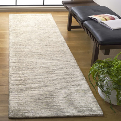 Tapis en laine et coton ivoire touffeté à la main Ebony