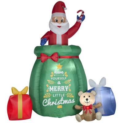 Père Noël gonflable gonflable géant dans un sac cadeau