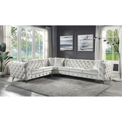 Canapé modulaire en tissu beige avec 4 coussins
