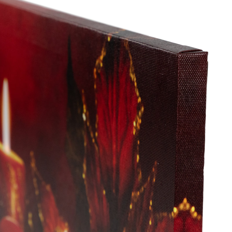 Bougies lumineuses rayées scintillantes avec poinsettia et nœud de Noël