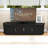 Mid-Century Modern TV Stand for TVs up to 75" with Sliding Fluted Doors and Hidden Storage-92806731