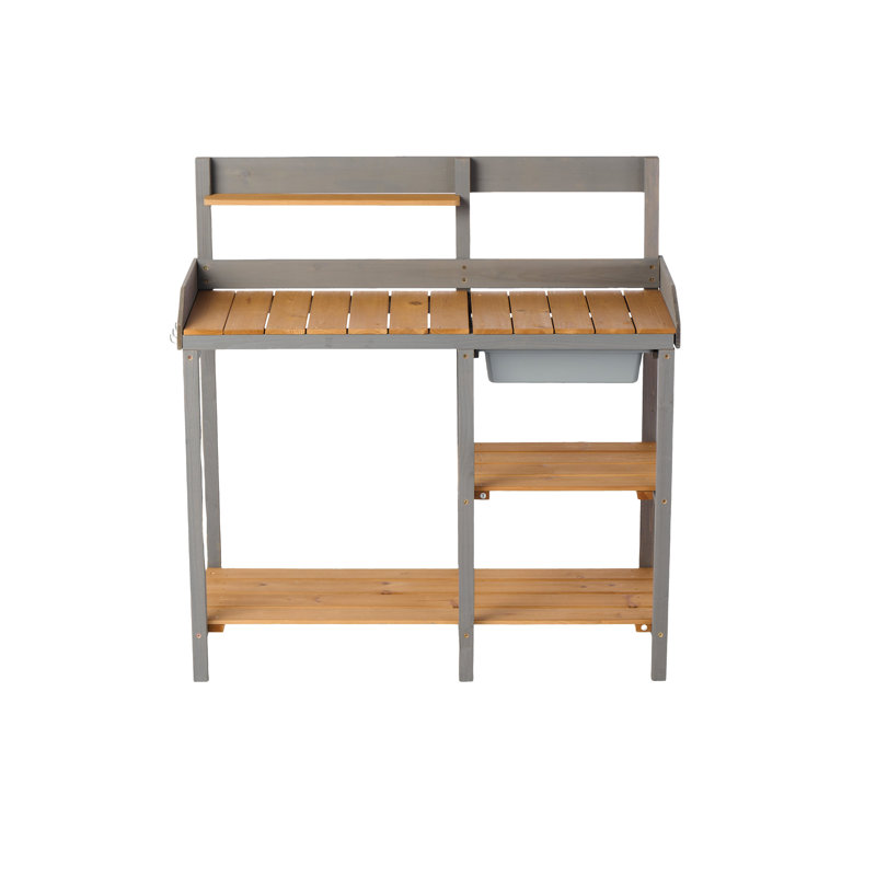 Établi de jardin dans la cour arrière, table de rempotage en bois avec armoire, plan de travail généreux, grande surface de travail extérieure de style brun et gris, fabrication en bois,