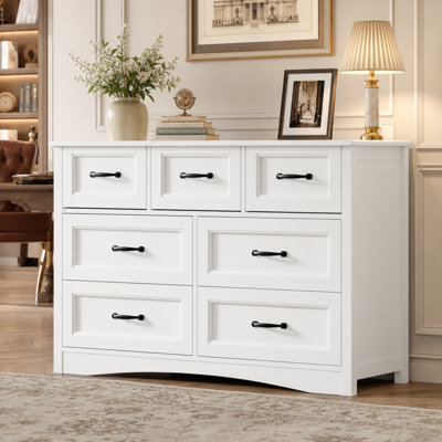 Commode à 7 tiroirs, 119 cm de largeur, en bois, avec système antibasculement, glissières métalliques lisses, grande capacité de rangement pour chambre, dressing ou salon, blanche.