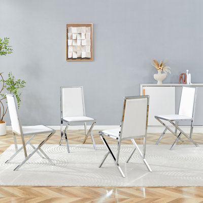 Ensemble de 4 chaises de salle à manger en polyuréthane blanc avec cadre en métal argenté: design ergonomique, un choix simple et luxueux. Comprend des pieds en métal argenté de conception unique.