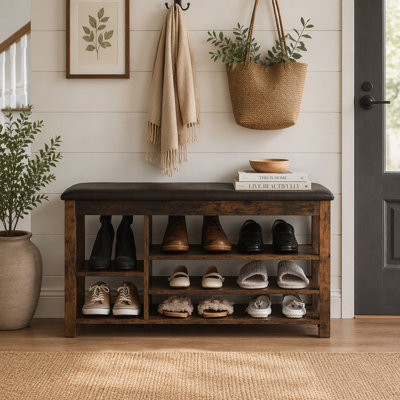 Banc à chaussures vintage en bois d'hévéa à grain anthracite avec rangement dissimulé et hauteur réglable, parfait pour les intérieurs de style nordique.