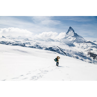 Man Looking At The Background Of Matterhorn. by Pathara - Wrapped Canvas Print